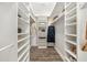 Organized walk-in closet with custom shelving and ample storage space at 408 166Th E St, Bradenton, FL 34212