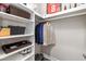 Well-organized walk-in closet with shelving and hanging space at 408 166Th E St, Bradenton, FL 34212