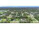 Wide aerial shot of a lush neighborhood featuring an abundance of trees at 4148 Lobelia St, North Port, FL 34286