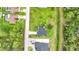 An aerial view of a home with mature trees and a spacious backyard at 4148 Lobelia St, North Port, FL 34286