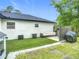 Cozy backyard featuring artificial turf, a grill, and comfortable outdoor seating for perfect relaxation at 4148 Lobelia St, North Port, FL 34286