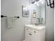 Bathroom featuring a modern vanity with mirror, towel bar, and gray walls at 4148 Lobelia St, North Port, FL 34286