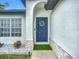 Close-up of a welcoming front door with wreath and stone detailing at 4148 Lobelia St, North Port, FL 34286