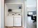 Laundry closet featuring a newer model LG washer and dryer set with shelves at 4148 Lobelia St, North Port, FL 34286