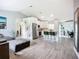 Open floor plan featuring wood flooring and stainless steel appliances at 4148 Lobelia St, North Port, FL 34286