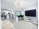 Open layout with living and dining areas, modern decor, and access to the kitchen at 4148 Lobelia St, North Port, FL 34286