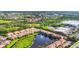 Beautiful aerial shot of townhomes around a lake with a fountain, close to shopping and other amenities at 4210 Vicenza Dr # D25, Venice, FL 34293