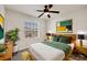 Comfortable bedroom featuring stylish decor and a ceiling fan for added comfort at 4210 Vicenza Dr # D25, Venice, FL 34293