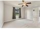 Bright bedroom with a ceiling fan and large window that offers plenty of natural light and an airy feel at 4210 Vicenza Dr # D25, Venice, FL 34293