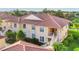 Attractive condos with terracotta roofs feature private entrances and access to outdoor spaces at 4210 Vicenza Dr # D25, Venice, FL 34293