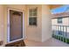 Inviting front porch with a decorative welcome mat and neutral-colored walls, offering a warm entry at 4210 Vicenza Dr # D25, Venice, FL 34293
