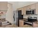 Well-lit kitchen featuring stainless steel appliances and granite countertops at 4210 Vicenza Dr # D25, Venice, FL 34293