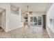 Bright living room with tile floors, ceiling fan, and sliding glass doors opening to a screened lanai at 4210 Vicenza Dr # D25, Venice, FL 34293