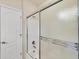 Clean bathroom shower with a sliding glass door, offering a modern and convenient bathing experience at 4210 Vicenza Dr # D25, Venice, FL 34293