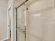 Clean bathroom shower featuring a sliding glass door and a sleek design, ready for relaxation and convenience at 4210 Vicenza Dr # D25, Venice, FL 34293