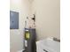 Utility room featuring a water heater and sink for added convenience at 4210 Vicenza Dr # D25, Venice, FL 34293