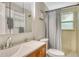 Bathroom with light tile and modern fixtures, and good lighting at 4214 Groveland Ave, Sarasota, FL 34231