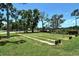 Outdoors horseshoe pit with several lanes offers recreational fun within a community park setting at 4214 Groveland Ave, Sarasota, FL 34231