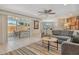 Cozy living room with stylish decor, and a view of the adjacent dining area at 4214 Groveland Ave, Sarasota, FL 34231