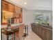 Comfortable living room with stylish desk area and a large painting at 4214 Groveland Ave, Sarasota, FL 34231