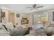 Inviting living room with ceiling fan and sliding doors to backyard at 4214 Groveland Ave, Sarasota, FL 34231