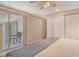 Spacious bedroom with closet and sliding door leading to an outdoor seating area at 4214 Groveland Ave, Sarasota, FL 34231