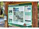 Informational park sign with map, history, and rules, enhancing visitors' experience at Red Bug Slough Preserve at 4214 Groveland Ave, Sarasota, FL 34231