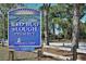 Entrance sign for Red Bug Slough Preserve with logo, address, and natural scenery for Sarasota County at 4214 Groveland Ave, Sarasota, FL 34231
