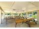 A covered picnic area features wooden picnic tables, offering a shaded space for gatherings and outdoor dining at 4214 Groveland Ave, Sarasota, FL 34231