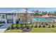 Community pool featuring lounge chairs, shade umbrellas, and well-maintained landscaping at 4336 112Th E St, Palmetto, FL 34221