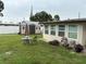 Spacious backyard with well-maintained lawn, shed, and a cozy patio set for outdoor relaxation at 4337 15Th N Ave, St Petersburg, FL 33713