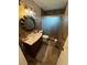 Bathroom features a stylish vanity with sink, matching toilet, and glass-enclosed shower, complemented by elegant tile work at 4337 15Th N Ave, St Petersburg, FL 33713