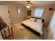 Bright bedroom with carpet, fan, artwork, dresser, and natural light creating a cozy atmosphere at 4337 15Th N Ave, St Petersburg, FL 33713