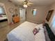 Comfortable bedroom featuring a ceiling fan, neutral walls and carpet. Features an orange dresser at 4337 15Th N Ave, St Petersburg, FL 33713