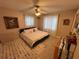 Cozy bedroom with neutral walls, a comfortable bed, ceiling fan, and carpeted floor, creating a warm atmosphere at 4337 15Th N Ave, St Petersburg, FL 33713