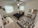 Nicely decorated bedroom features a modern bed set, bright windows, vanity, and matching rug and decor at 4337 15Th N Ave, St Petersburg, FL 33713