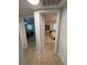Hallway view featuring two bedrooms each with ample light and ceiling fans at 4337 15Th N Ave, St Petersburg, FL 33713