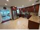 Spacious kitchen features granite countertops, stainless steel appliances and dark-stained wood cabinets at 4337 15Th N Ave, St Petersburg, FL 33713