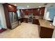 Well-appointed kitchen features granite countertops, stainless steel appliances and dark-stained wood cabinets at 4337 15Th N Ave, St Petersburg, FL 33713