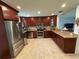 Bright kitchen features granite countertops, stainless steel appliances and dark-stained wood cabinets at 4337 15Th N Ave, St Petersburg, FL 33713
