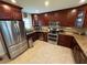 Updated kitchen features granite countertops, stainless steel appliances and dark-stained wood cabinets at 4337 15Th N Ave, St Petersburg, FL 33713