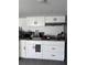 Modern kitchen with white cabinets, granite countertops, and stainless steel appliances at 4337 15Th N Ave, St Petersburg, FL 33713