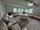 Bright living room with elegant furniture, decorative pillows, and large windows offering plenty of natural light at 4337 15Th N Ave, St Petersburg, FL 33713