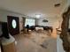 Elegant living room showcasing stylish seating, an ornate mirror, and a view of the entryway at 4337 15Th N Ave, St Petersburg, FL 33713