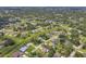 Wide aerial shot showcasing community homes, streets, and the area's landscape at 4357 Mermell Cir, North Port, FL 34291