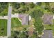 Aerial view of the home showcasing its layout, surrounding landscaping, and neighborhood at 4357 Mermell Cir, North Port, FL 34291