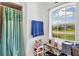 Bathroom with a shower, window, and ample storage at 4357 Mermell Cir, North Port, FL 34291