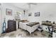 Bedroom with a bed, dresser, and unique tiled floor at 4357 Mermell Cir, North Port, FL 34291