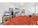 Spacious bedroom with tile flooring, ceiling fan, closet, and natural light from a large window at 4357 Mermell Cir, North Port, FL 34291