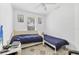 Bedroom with two beds, tiled floors, and bright natural light at 4357 Mermell Cir, North Port, FL 34291